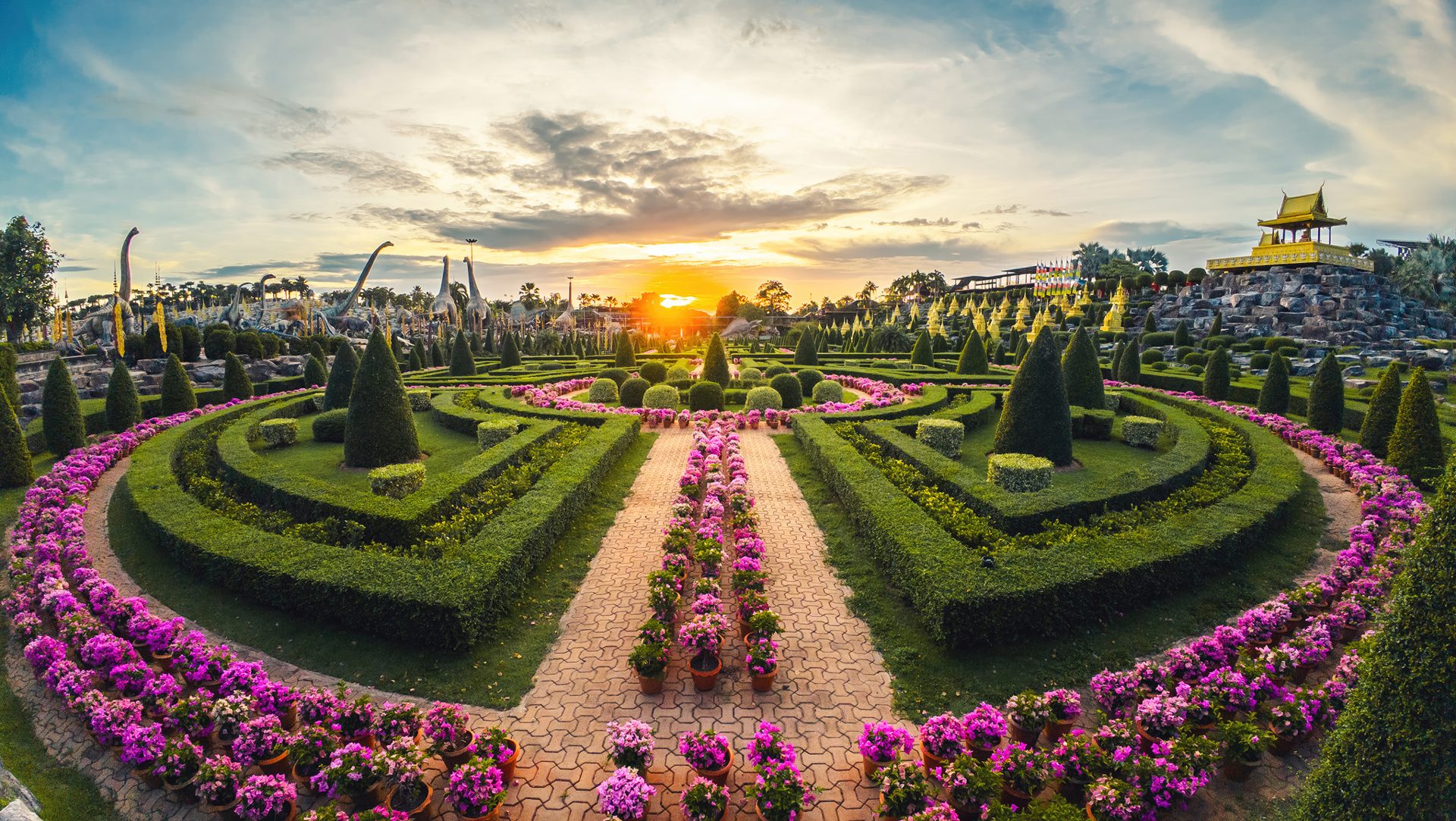 Decorative garden landscape at sunset at Nong Nooch Tropical Garden near Pattaya