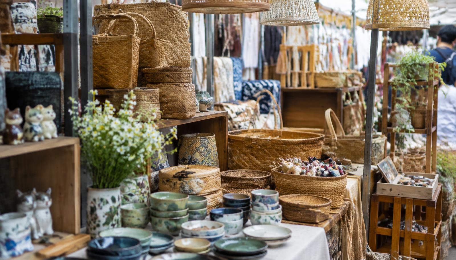 Woven baskets, ceramic bowls and handmade home décor displayed at a Bangkok market stall